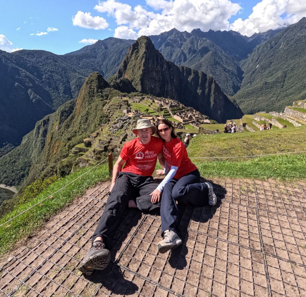 Hikers on the Short Inca Trail 2 day route passing ancient Inca ruins en route to Machu Picchu